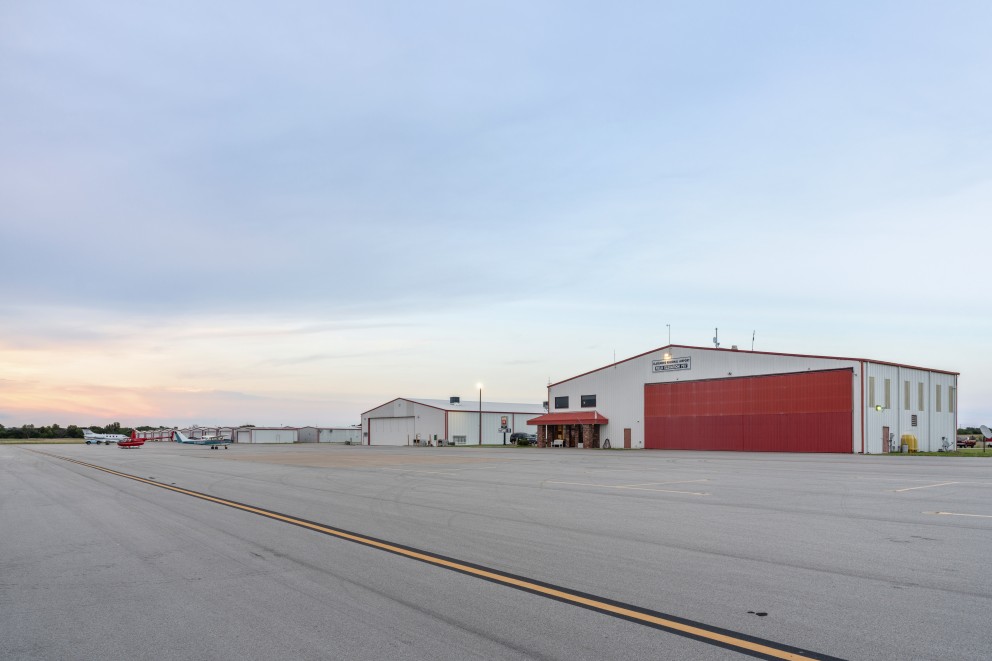 man standing beside plane