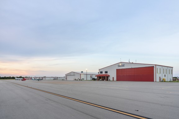 man standing beside plane